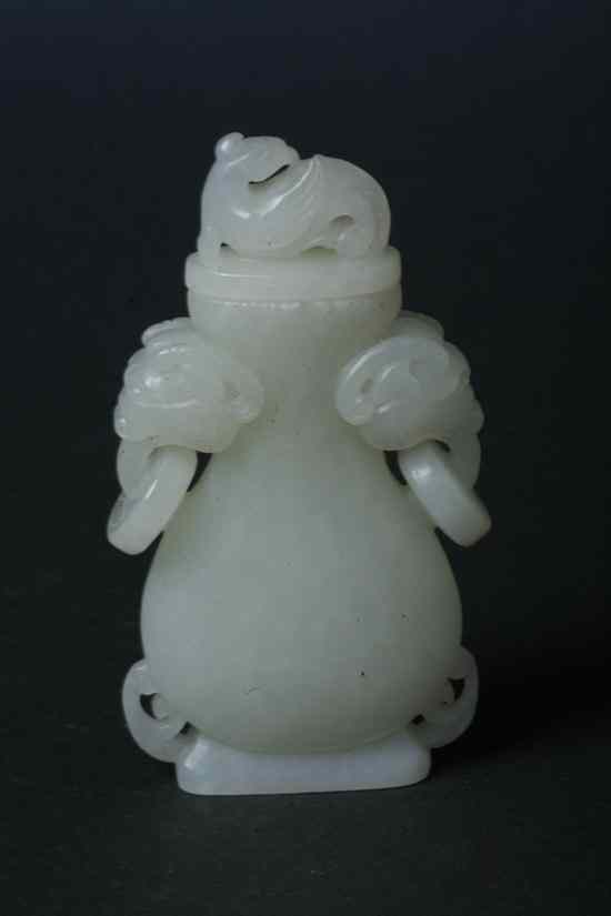 Appraisal: CHINESE WHITE JADE VASE AND COVER Fu lion-form handles -