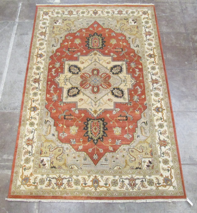 Appraisal: HAND KNOTTED ORIENTAL CARPET Persian Serapi design central geometric medallion