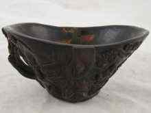 Appraisal: A carved horn Chinese libation cup approx cm long