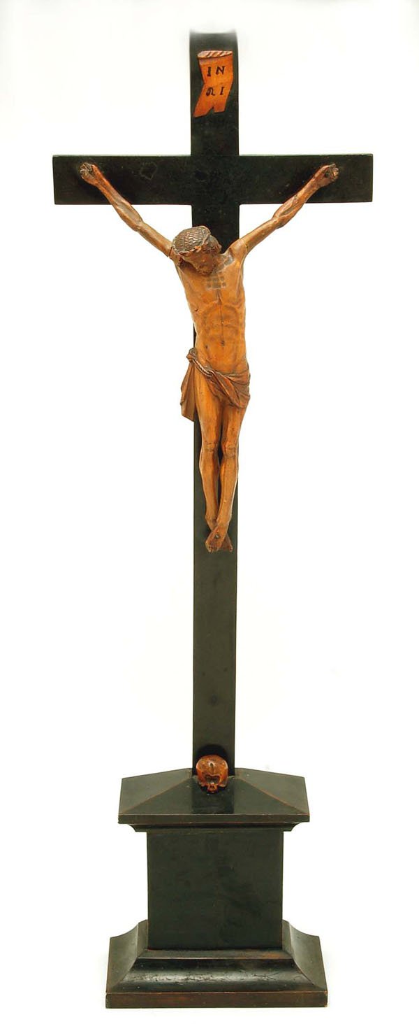 Appraisal: A carved wood crucifix The figure of Christ carved of