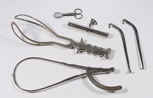 Appraisal: OBSTETRICAL INSTRUMENTS lot includes a pair of steel obstetrical forceps