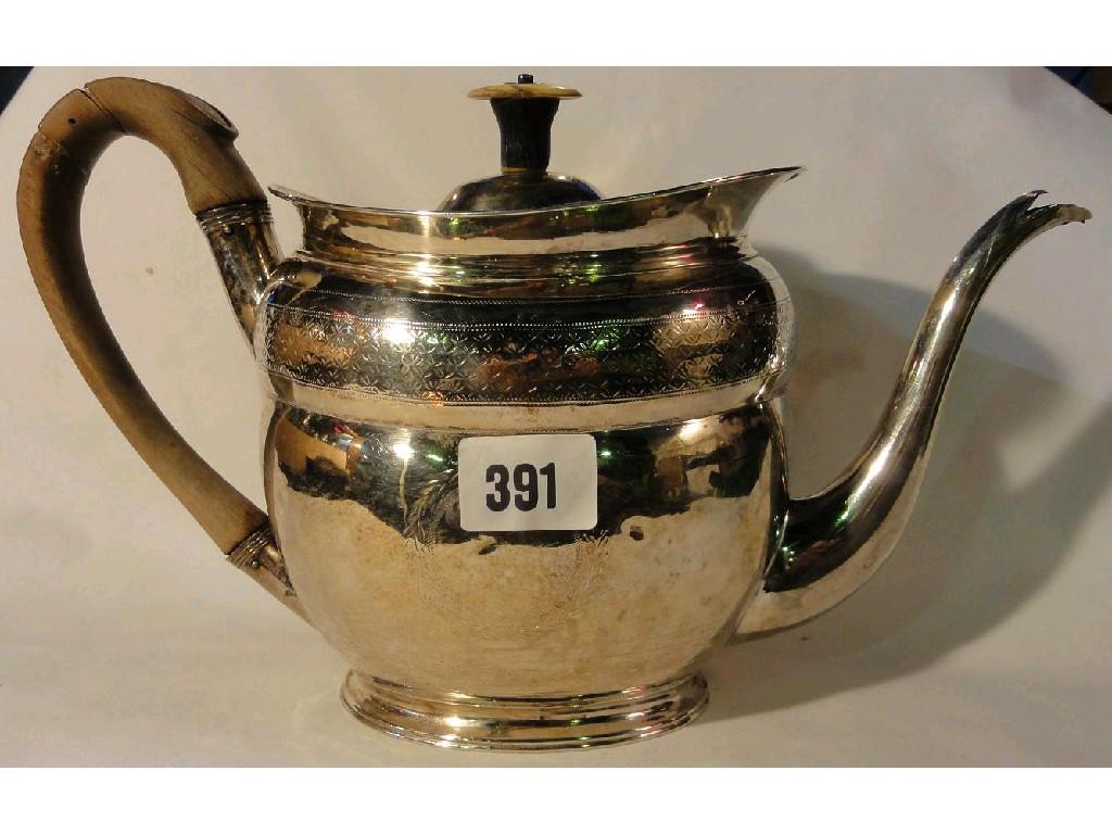 Appraisal: A Georgian silver teapot in the classical manner with engraved