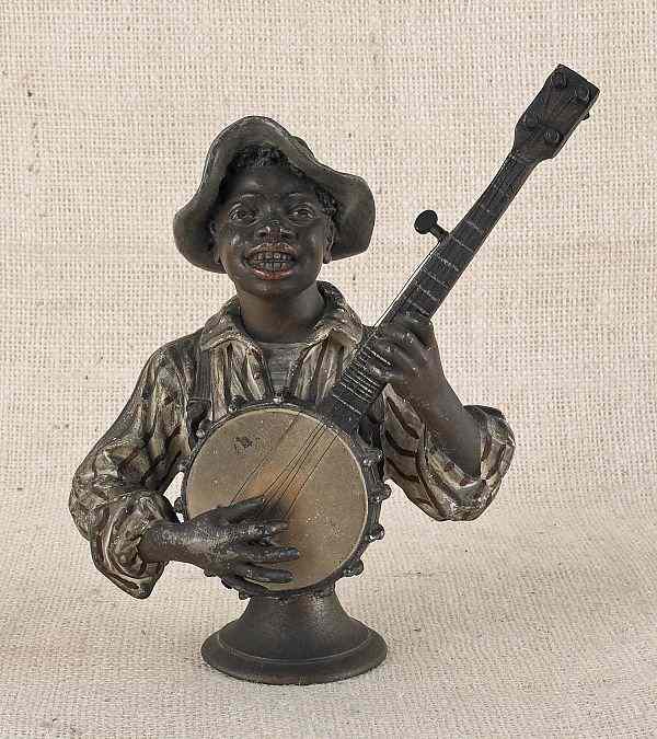 Appraisal: Painted bronze and white metal figure of a black boy