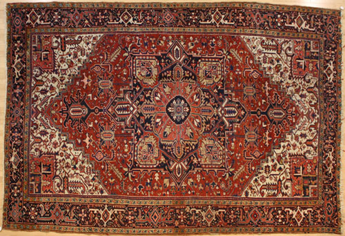 Appraisal: Heriz carpet ca with a central medallion on a red