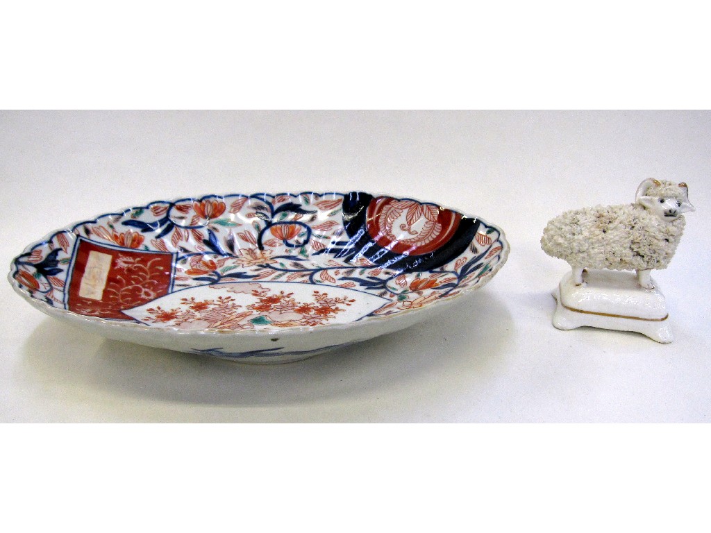 Appraisal: Imari oval shaped dish and a Staffordshire figure of a