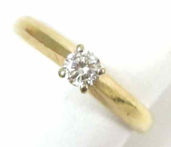 Appraisal: DIAMOND AND YELLOW GOLD SOLITAIRE RING k gold set with