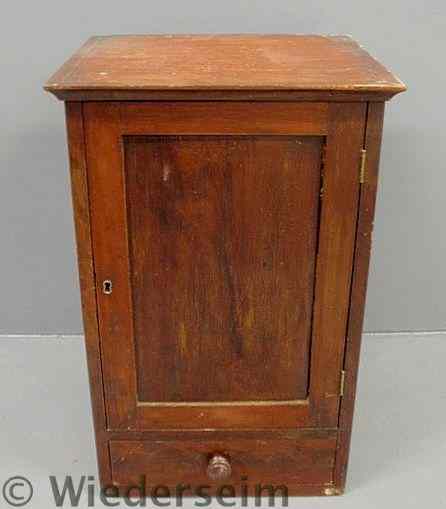 Appraisal: Small mahogany cabinet early th c with a single door