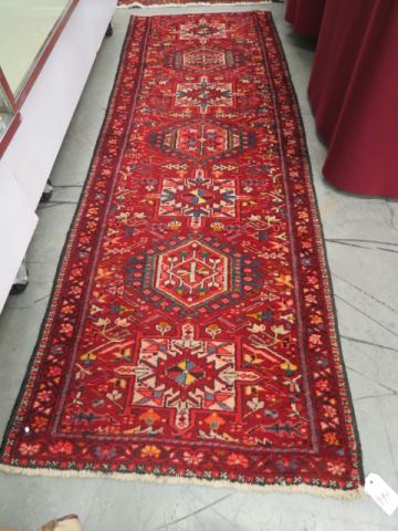 Appraisal: Heriz Persian Handmade Rug fine geometric medallions rich red field