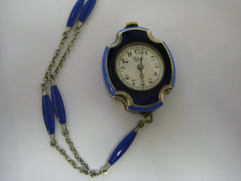 Appraisal: EBEL ENAMEL PENDANT WATCH Sterling silver with gold wash lady