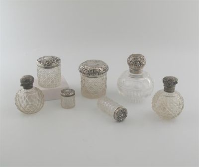 Appraisal: Seven various mounted cut glass bottles jars