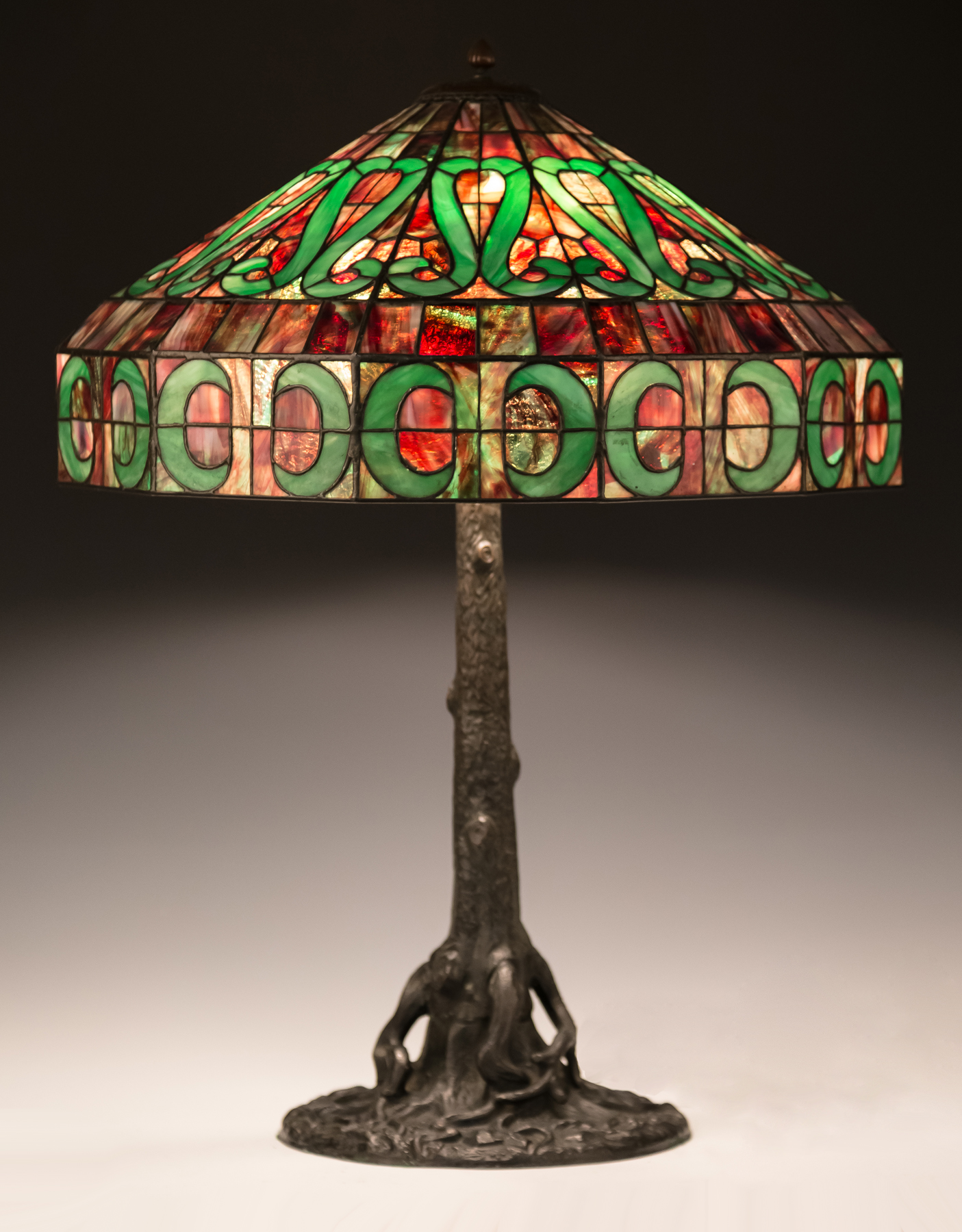 Appraisal: Leaded Glass Lamp with Stylized Design Early th century Patinaed