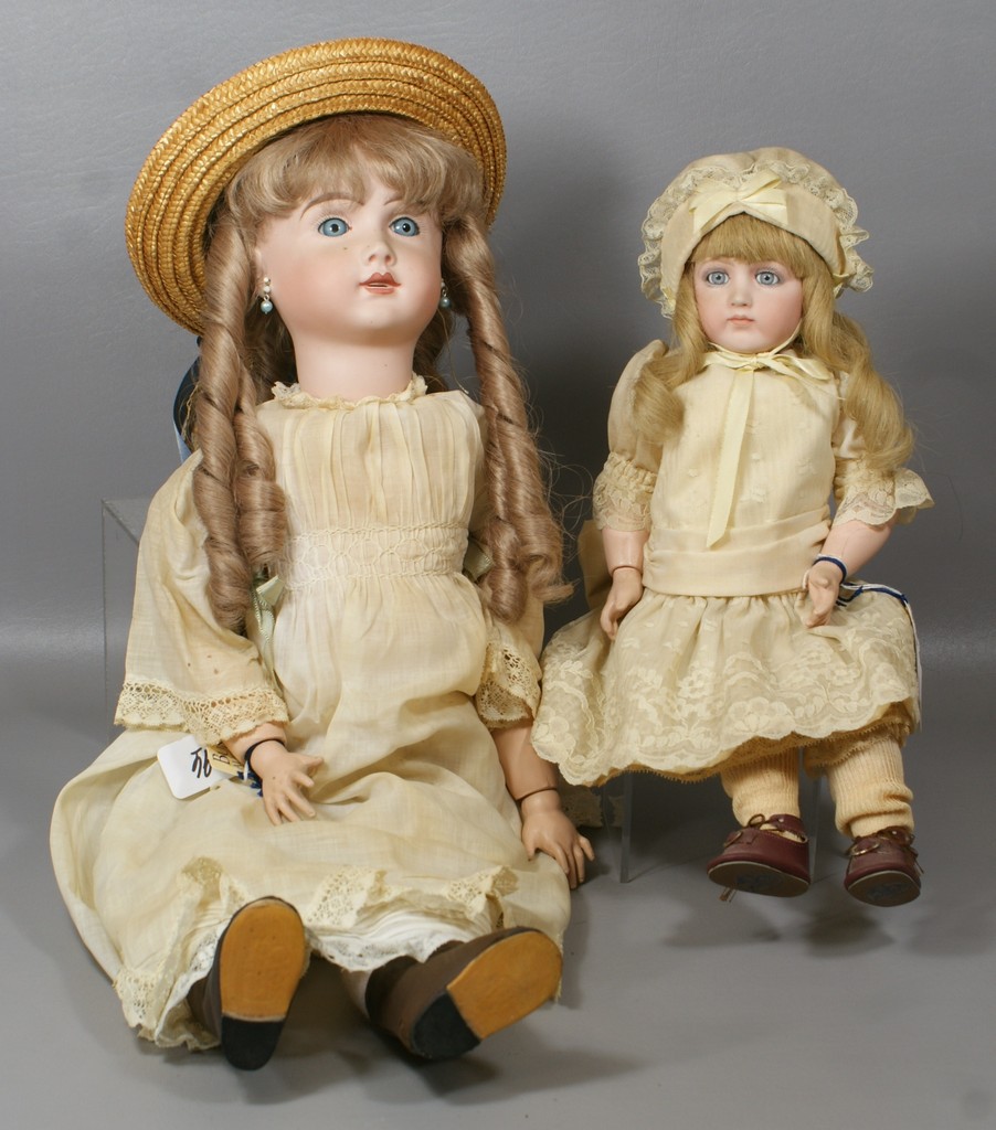 Appraisal: Reproduction French Dolls larger a replica of an open mouth