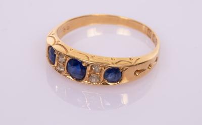 Appraisal: A sapphire and diamond ring in ct gold the three