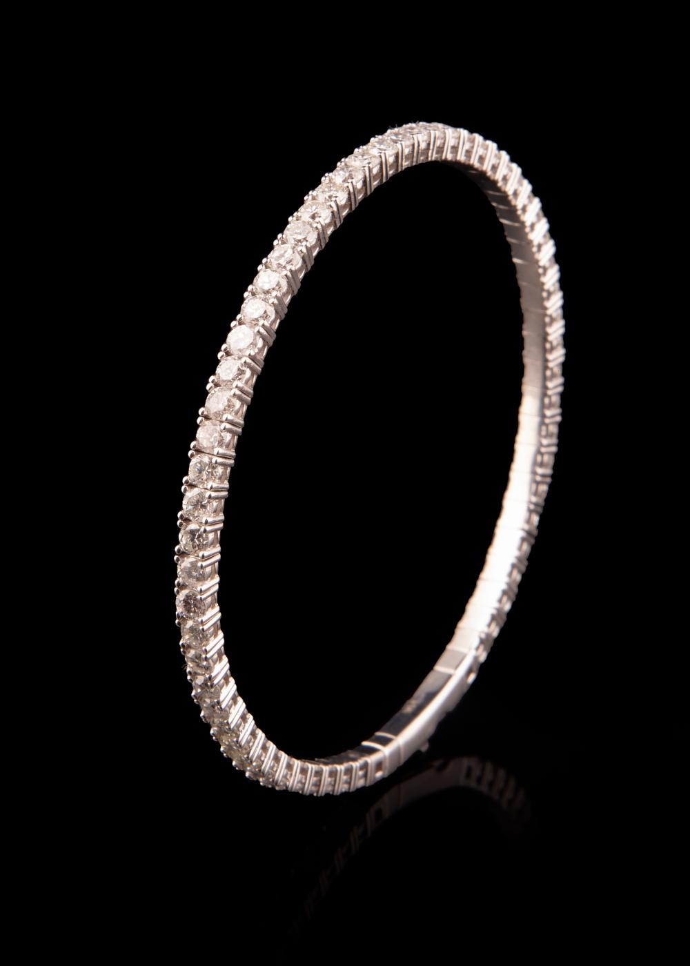 Appraisal: kt White Gold and Diamond Flexible Bangle Bracelet mounted with