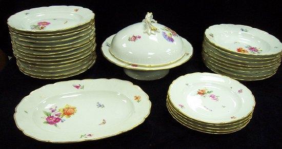 Appraisal: A part Berlin dinner service decorated flowers and butterflies comprising