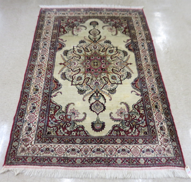 Appraisal: SEMI-ANTIQUE TURKISH AREA RUG centering a large floral medallion on