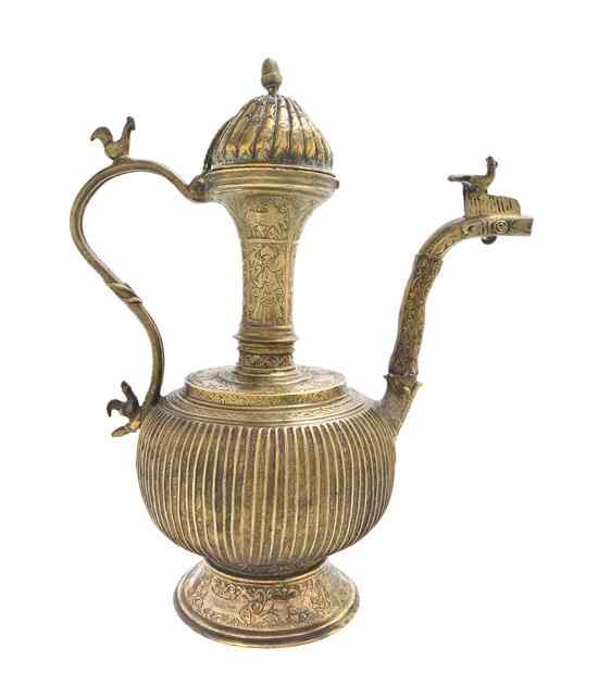 Appraisal: A Middle Eastern Brass Ewer of baluster form with incised