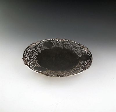 Appraisal: A silver dish by Gladwin Limited circular form pierced foliate