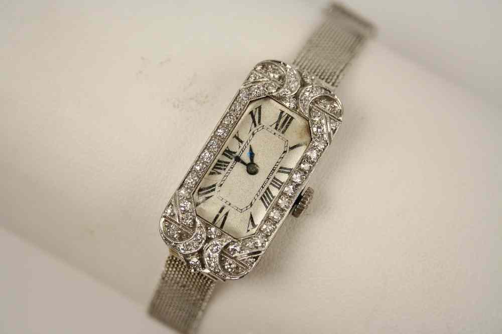 Appraisal: LADY'S WATCH - Edwardian Platinum and Diamond case quartz movement