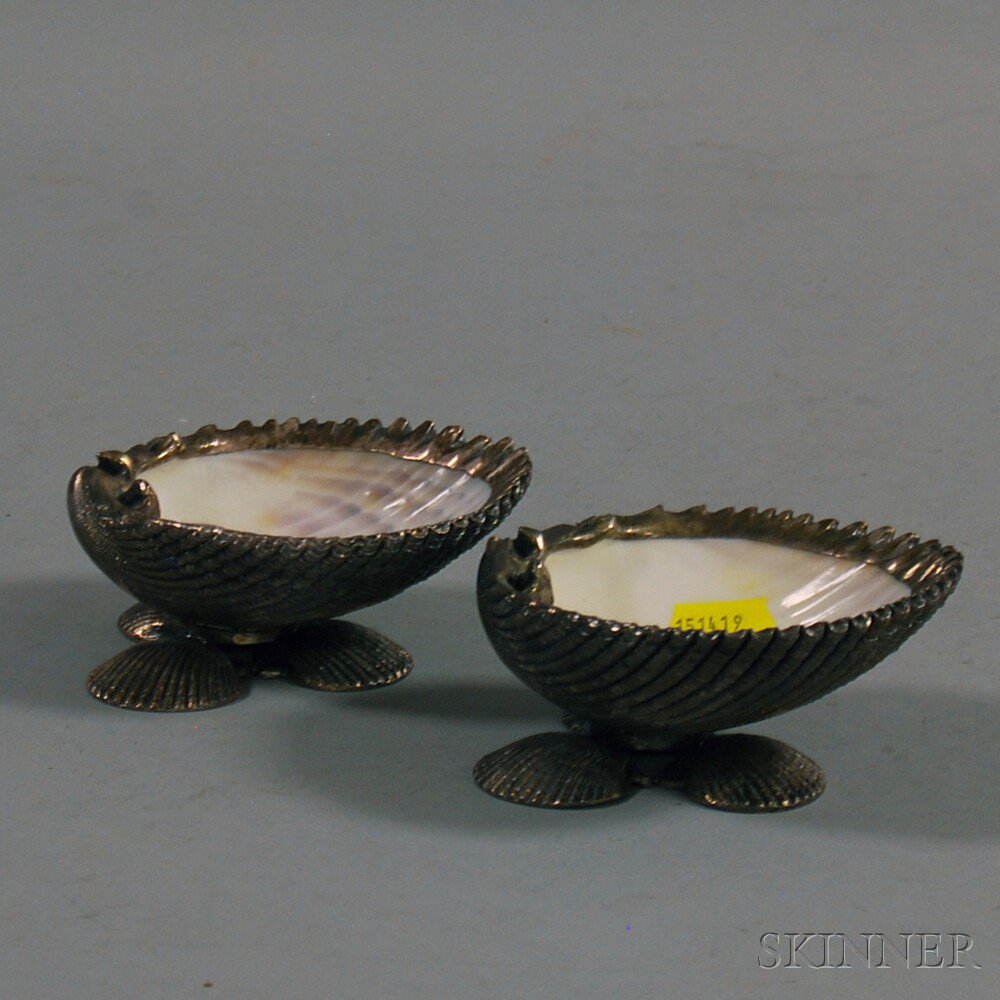 Appraisal: Pair of Italian Silver-clad Seashell Footed Salts each composed of