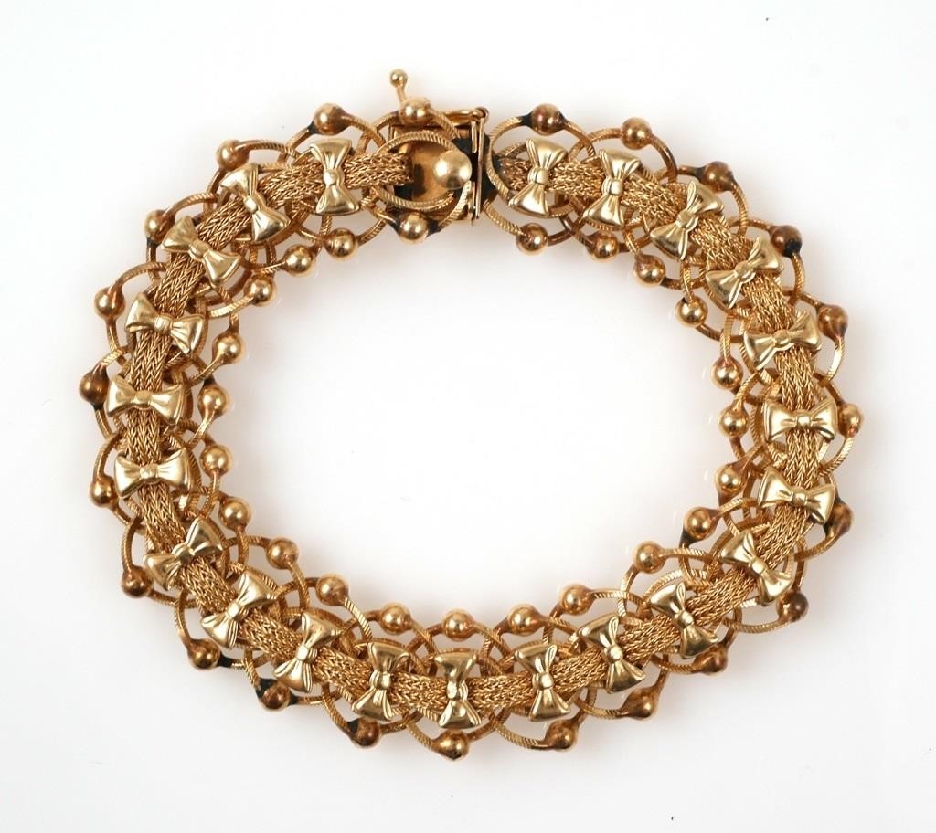 Appraisal: K yellow gold bracelet featuring fancy bowtie and bead links