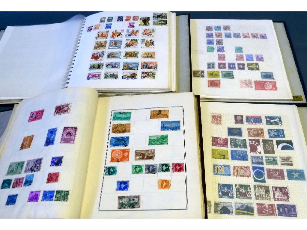 Appraisal: FOUR WELL FILLED ALBUMS with stamps of the world EST