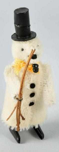 Appraisal: Scarce Schuco Bear Snowman Wind-Up Toy Description German Working Fur-covered