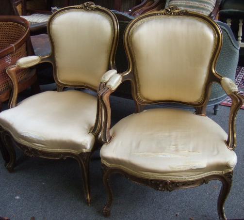 Appraisal: A pair of Louis XV style gilt painted fauteuils the