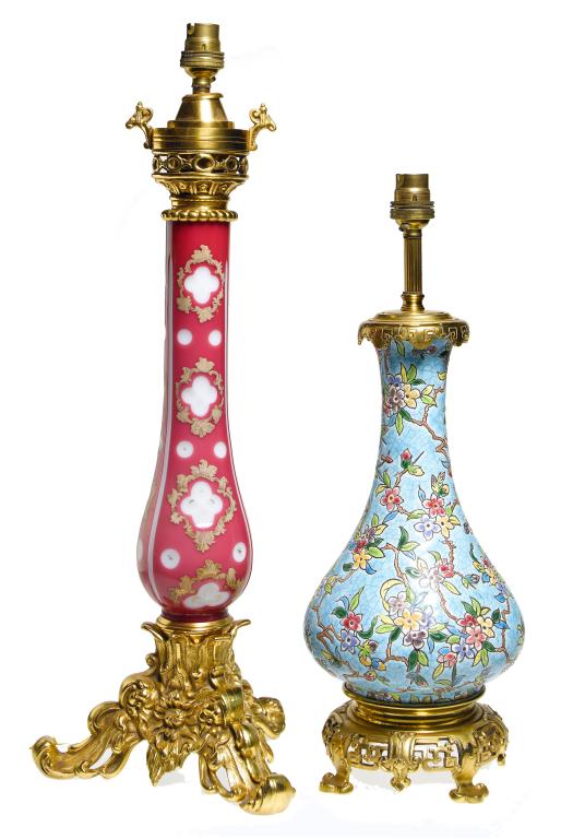 Appraisal: A GILT BRASS-MOUNTED PINK OVERLAID WHITE GLASS LAMP on triform