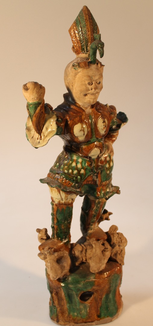 Appraisal: A Chinese terracotta Tang style figure of a warrior partially