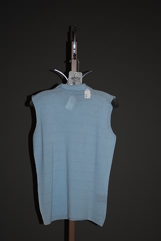 Appraisal: Giorgio Armani Aqua wool sleeveless turtleneck knit shell with cutout