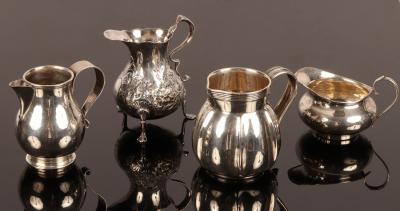 Appraisal: Four silver jugs including one of baluster shape London and