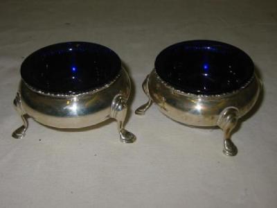 Appraisal: A PAIR OF VICTORIAN SALTS of bellied circular form with