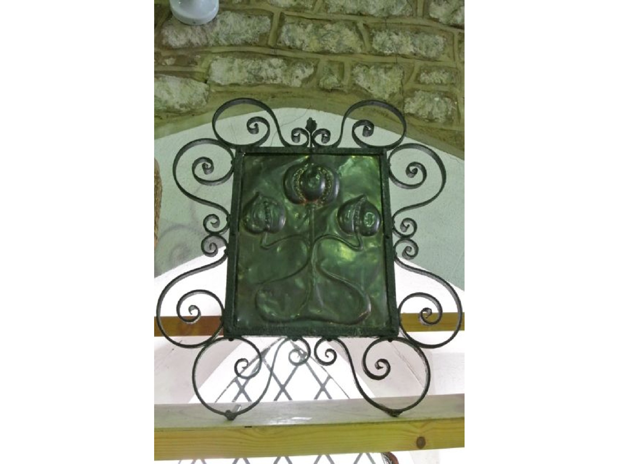 Appraisal: A th century fire guard the worked copper central panel