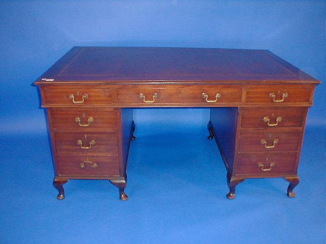 Appraisal: An early th century mahogany pedestal desk with leather inset