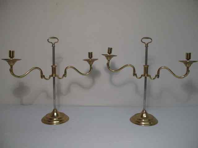 Appraisal: Pair of Baldwin Williamsburg brass candle sticks Adjustable for height