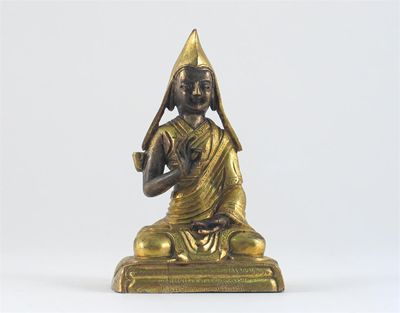 Appraisal: A Tibetan gilt bronze figure of a Lama seated in