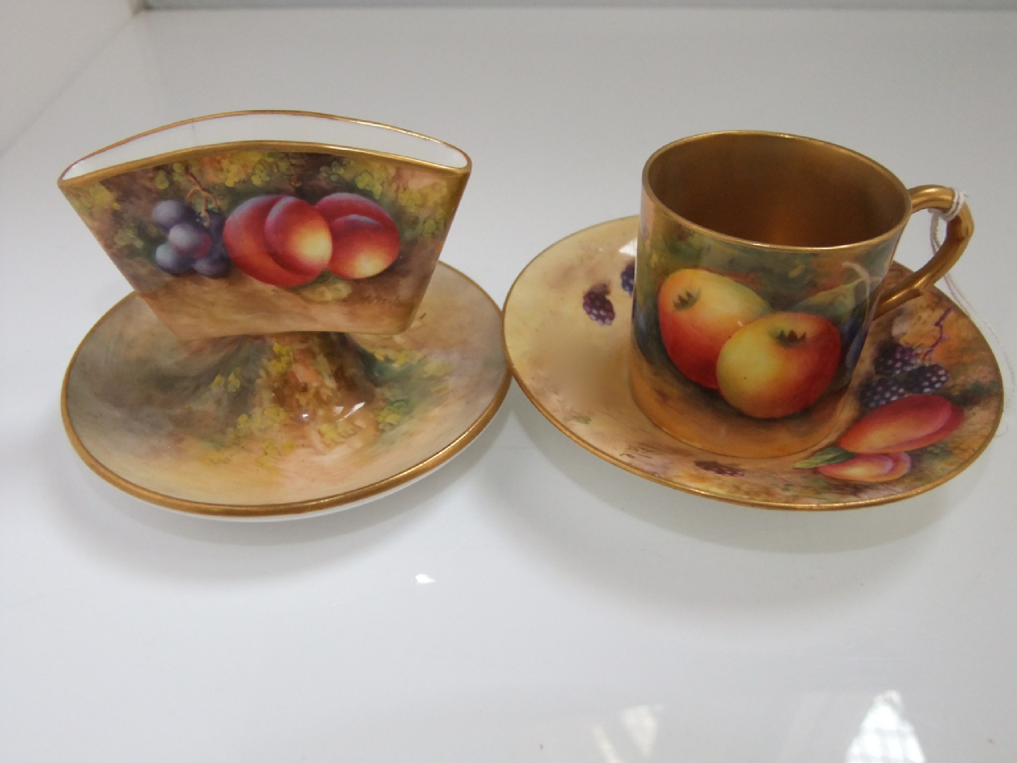 Appraisal: A Royal Worcester cabinet coffee can and saucer with painted