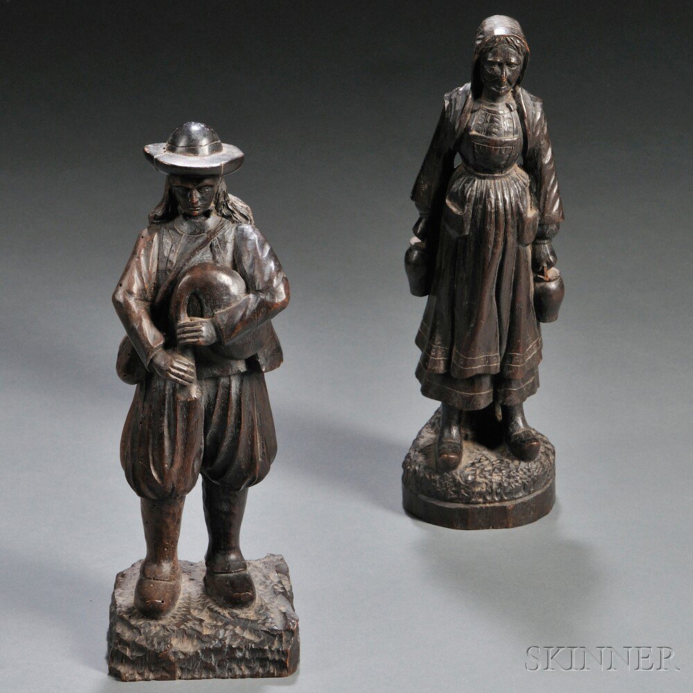 Appraisal: Two Carved Walnut Peasant Figures northern Europe th th century