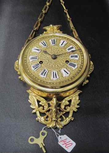 Appraisal: AN UNUSUAL AMERICAN WATERBURY GILT METAL WALL CLOCK in the