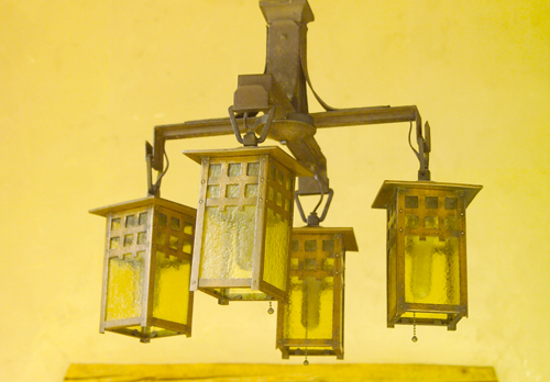 Appraisal: GUSTAV STICKLEY Copper chandelier with four four-sided lanterns lined in