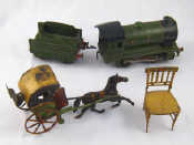 Appraisal: A vintage tinplate horse and two wheeled open carriage AF