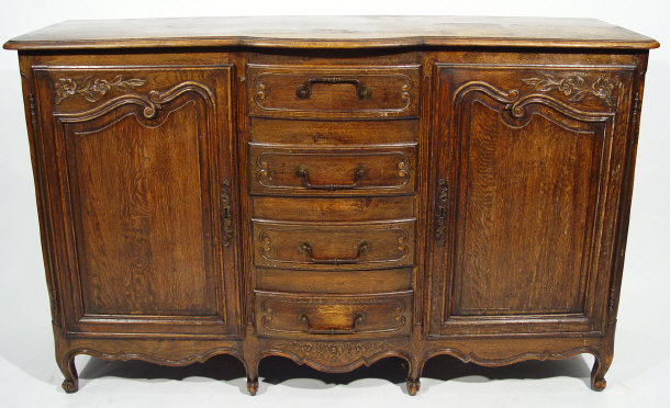 Appraisal: Oak sideboard fitted with four bow fronted central drawers flanked