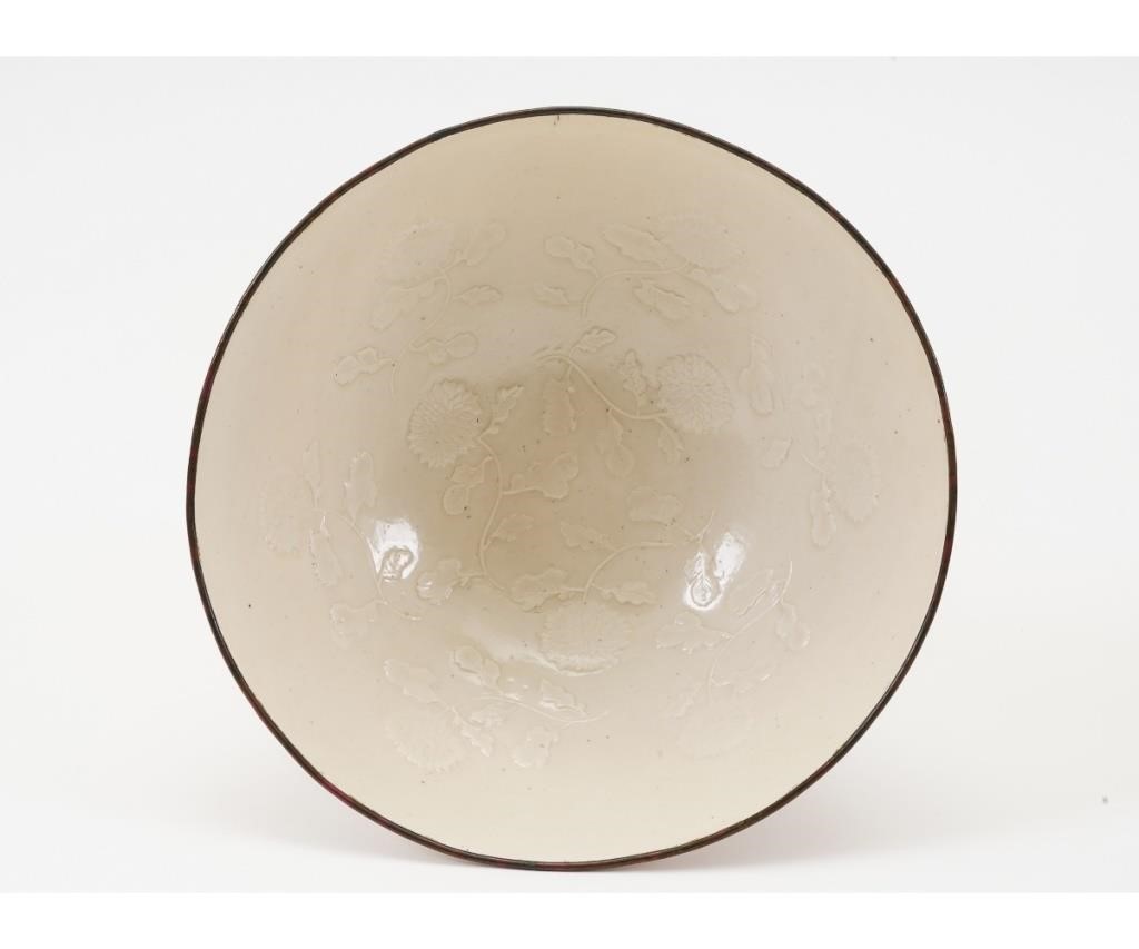 Appraisal: Creamy white glazed Ting ware bowl with raised chrysanthemum flowers