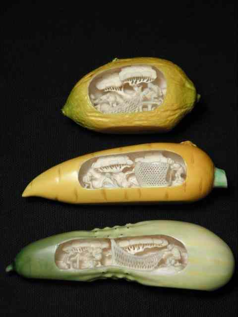 Appraisal: Three carved ivory polychrome vegetables with internal village scenes Includes