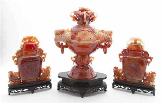 Appraisal: A Carved Carnelian Urn and Vases each of deep iron