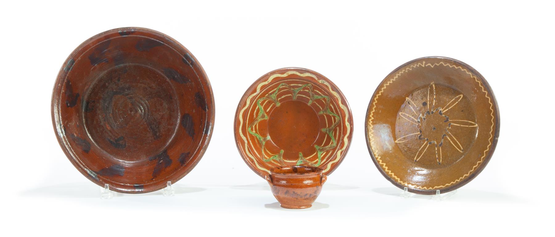 Appraisal: FOUR AMERICAN REDWARE PIECES Mid th century Bowl with orange