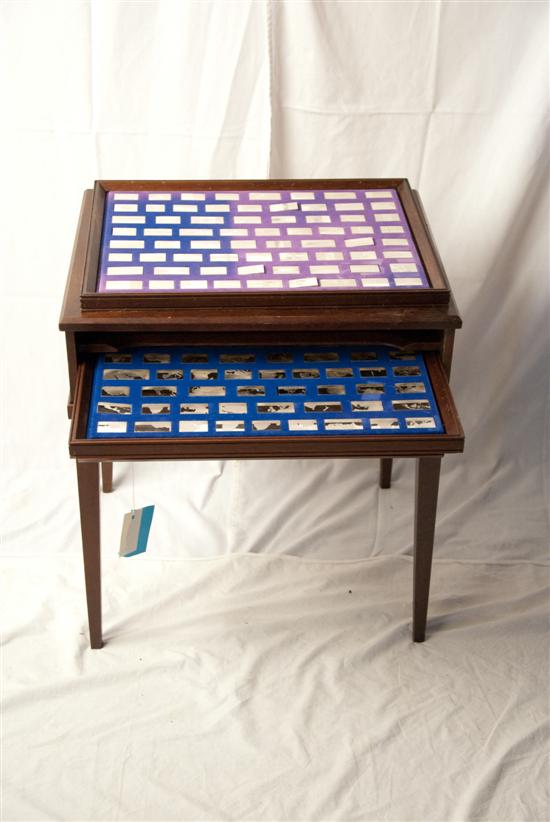 Appraisal: Table with levels of Sterling Ingots with Flags and Maps