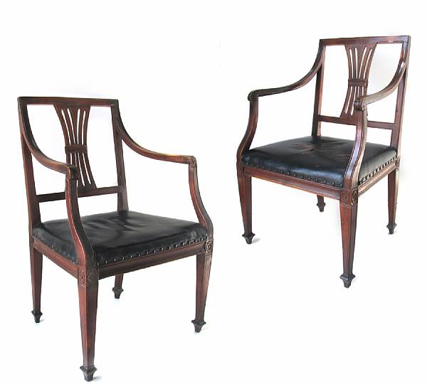 Appraisal: A pair of Continental Neoclassical carved walnut and black leather