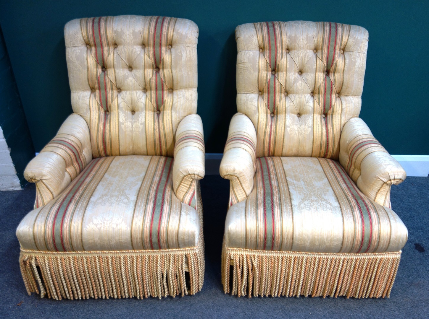 Appraisal: A pair of th century button back easy armchairs each